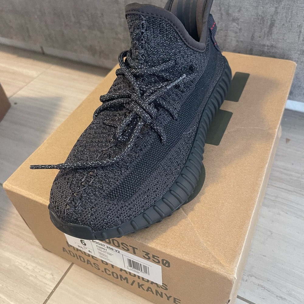 Yeezy black sneakers brand new with tags and box.